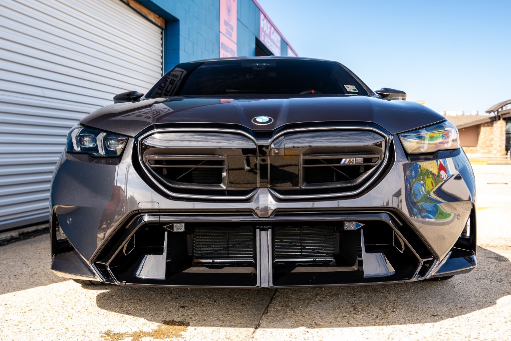 PPF being applied to a BMW grille at Surface Protection Studio