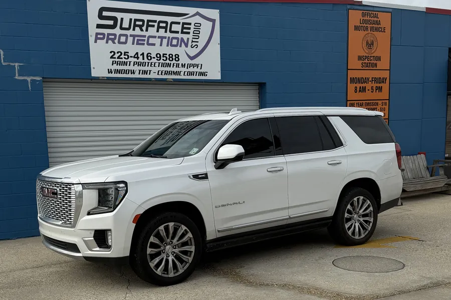 White GMC Yukon Denali with a full vehicle ceramic window tint at Surface Protection Studio